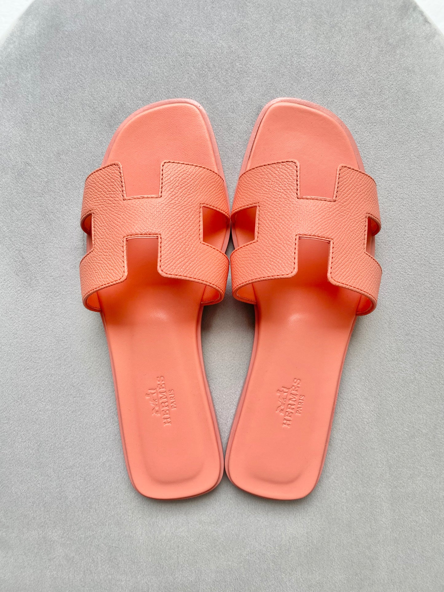 HERMÈS Oran Sandals in Orange Joey