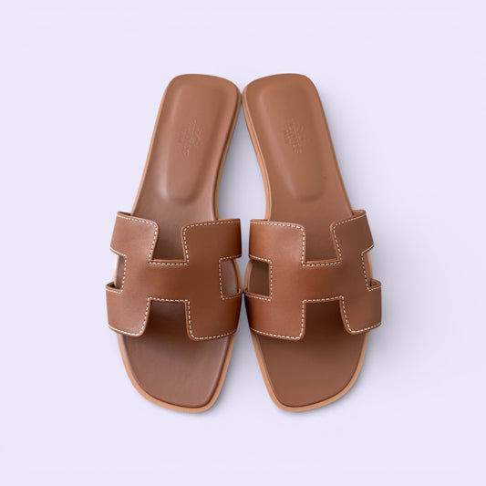 Hermès Oran Sandals Gold